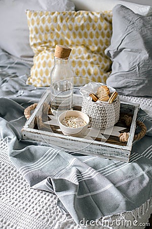 breakfast on a wooden tray on the bedin the bedroom Stock Photo
