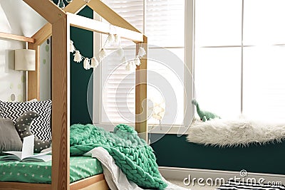 Cozy child room interior with bed Stock Photo