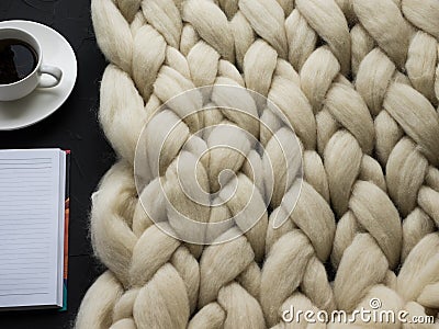 Cozy composition, closeup merino wool blanket, warm and comfortable atmosphere. Knit background Stock Photo
