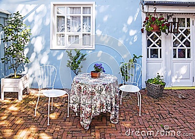 Cozy courtyard of a street cafe Stock Photo