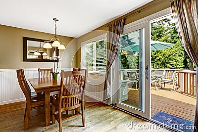 Cozy dining area and walkout deck Stock Photo