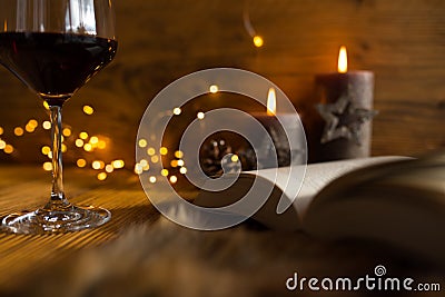 Cozy evening with wine and a good book Stock Photo