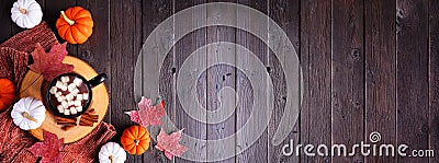 Cozy fall corner border over a dark wood banner background Stock Photo