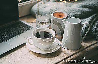 Cozy freelancer`s winter work place at home with cup of coffee Stock Photo