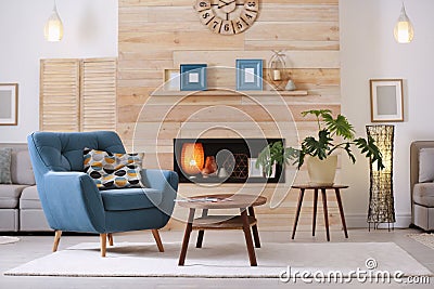 Cozy furnished apartment with niche in wooden wall Stock Photo