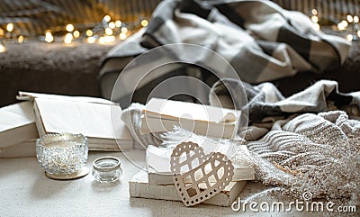 Cozy home composition with decorative wooden heart and books and decor details Stock Photo