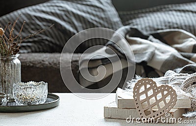 Cozy home composition with decorative wooden heart and books and decor details Stock Photo