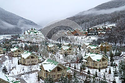 Cozy houses in snowy mountains. Krasnaya Polyana Editorial Stock Photo