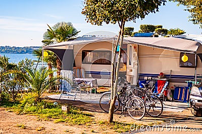 Cozy inside landscape design of camping La Ca located on the southern shore of Garda lake. Area for tents, campers, bungalows, Editorial Stock Photo