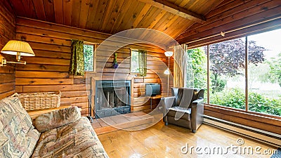 Cozy interior of a rustic log cabin Stock Photo