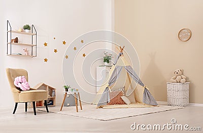Cozy kids room interior with play tent Stock Photo