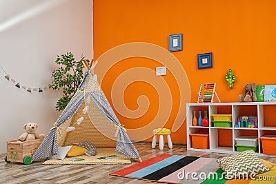 Cozy kids room interior with play tent Stock Photo