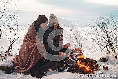 Cozy picnic in the cold season with tea and a blanket Stock Photo
