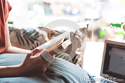 Cozy pillow and girl, reading a book. Stock Photo