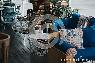 Cozy restaurant interior with wooden blue modern sofas Stock Photo