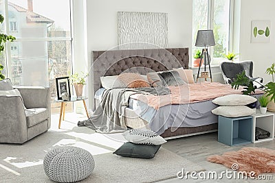 Cozy room interior with large comfortable be Stock Photo