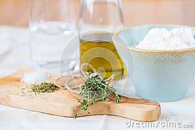 Cozy rustic home kitchen still life, dried herbs thyme, salt. Stock Photo