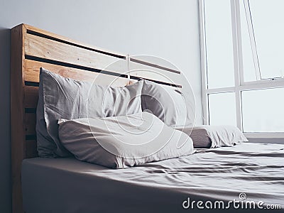 Cozy simple loft wooden bed. Stock Photo