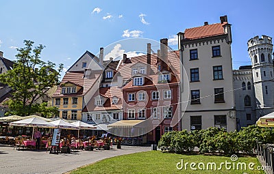 Cozy square with tables of decorated flowers street cafe in Riga, Latvia Editorial Stock Photo