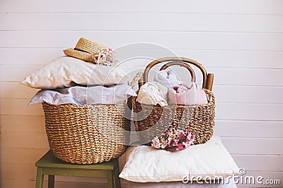 Cozy still life interior details. Organizing clothes in wicker baskets Stock Photo