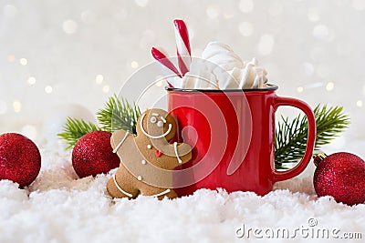 Cozy winter composition with a cup of hot chocolate with marshmallows gingerbread man cookies on a light background Stock Photo