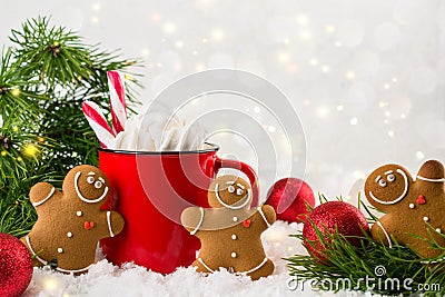 Cozy winter composition with a red cup of hot chocolate with marshmallows gingerbread man cookies on a festive background Stock Photo