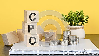 CPO - text on wood cubes stack, yellow background Stock Photo