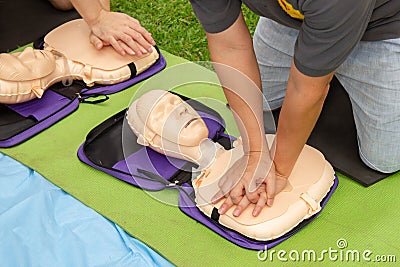CPR trainning to a patient sudden cardiac arrest with Patient model. Stock Photo