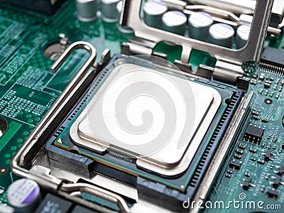 CPU connector on the circuit motherboard with pressure contacts for connecting a silicon microprocessor, CPU selection during comp Stock Photo