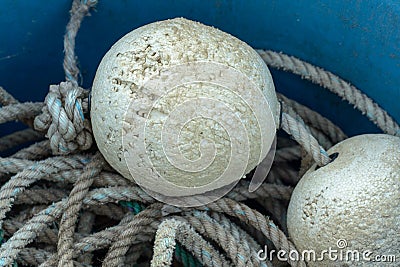 Crab fishing floats and rope in a blue bucket Stock Photo