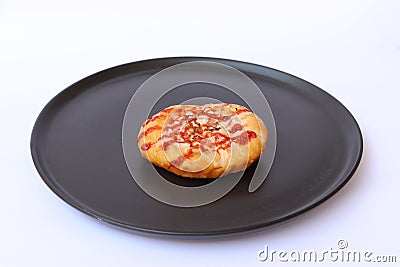 Crab sticks bread mayonnaise with ketchup and dried oregano topping in the black round plate Stock Photo