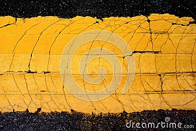 Crack yellow line painted on asphalt road Stock Photo