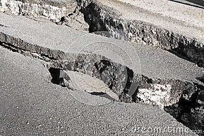 Cracked asphalt pieces background Stock Photo