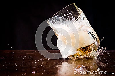 Cracked beer glass Stock Photo