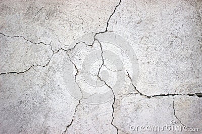 cracked concrete wall covered with gray cement texture as background for design Stock Photo