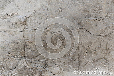 cracked concrete wall covered with gray plaster surface as background Stock Photo