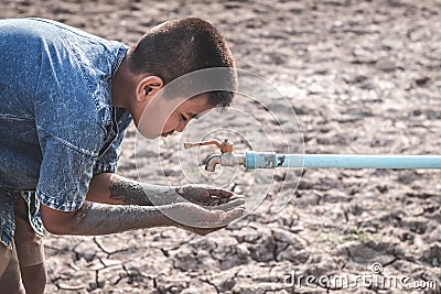 The cracked dry ground due to drought. Stock Photo