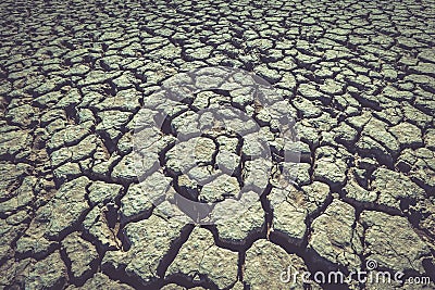 Cracked earth, clay loam as background or backdrop Stock Photo