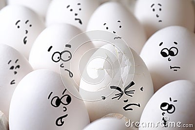 Cracked egg among all eggs Stock Photo