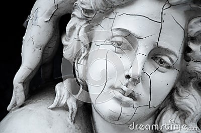 Cracked face of female Greek sculpture Stock Photo