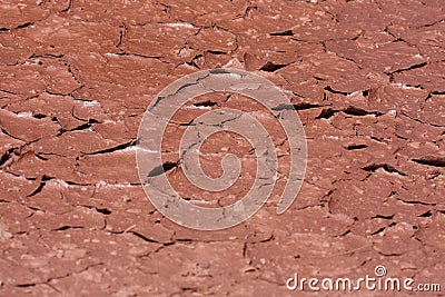 Cracked red earth in desert Stock Photo