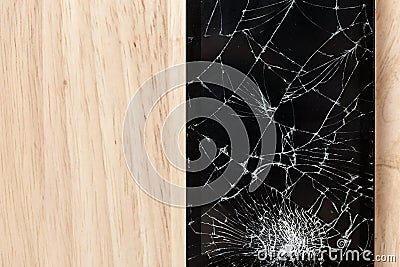 Cracked screen of smartphone mobile black glasses top view photography. Stock Photo