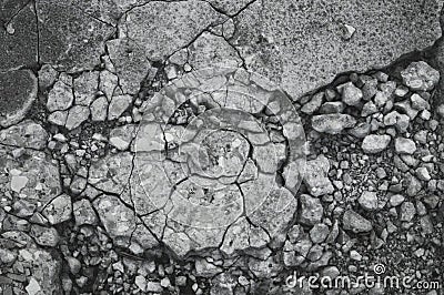 Cracked texture of small gravel stone in a concrete slab cement floor close up Stock Photo
