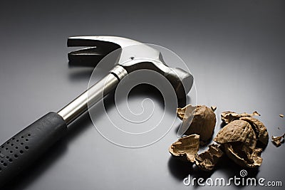 Cracked Walnut and Hammer Stock Photo