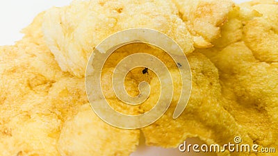 Cracker chips made from melinjo or belinjo seeds, Indonesian specialty Gnetum gnemon, selected focus, on white background Stock Photo