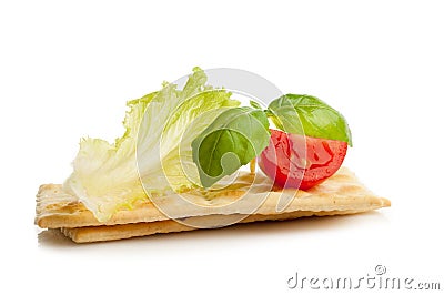 Crackers with salad tomato and basil Stock Photo