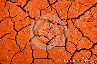 Crackinged land of the red colour in desert Stock Photo