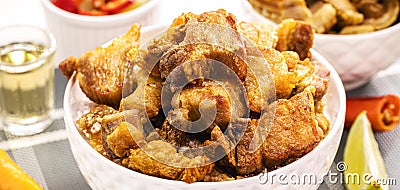 Crackling bowl, Brazilian appetizer made by frying bacon, leather or meat and lots of fat, taken from the pork belly Stock Photo