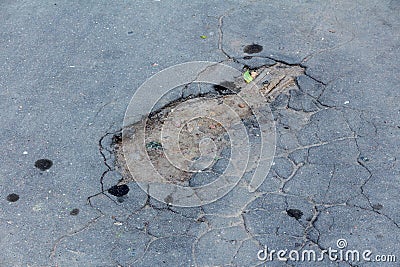 Damaged asphalt road Stock Photo