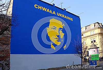 A mural painting depicting Ukrainian president Volodymyr Zelensky in blue-yellow duotonein Cracow, Poland Editorial Stock Photo